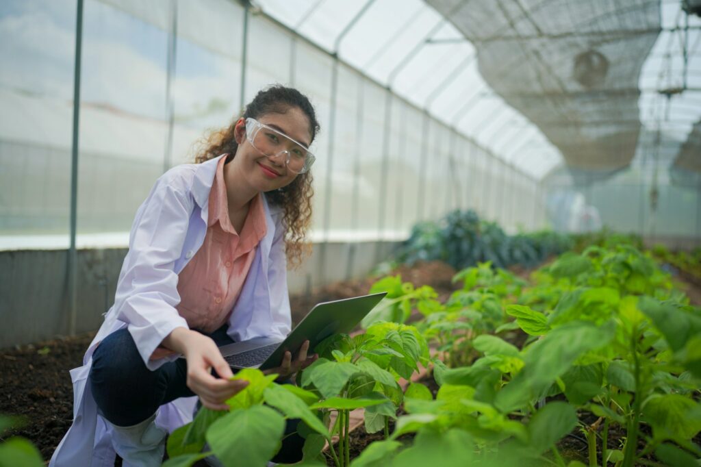 Organic Farmer Eco Agriculture researchers at smart organic farm. Innovative agricultural technology